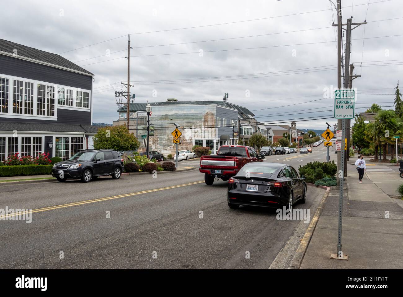Tacoma, WA USA - circa August 2021: Street view of traffic in Old Town Tacoma on an overcast day. Stock Photo