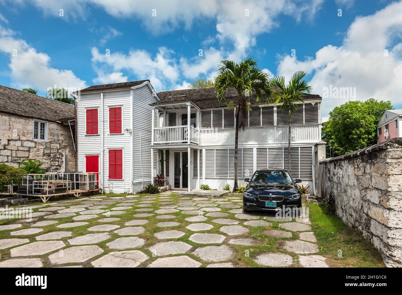 Nassau, Bahamas - May 3, 2019: Street view of Nassau at day with a car in the yard near a typical residential building in Nassau, New Providence, Baha Stock Photo