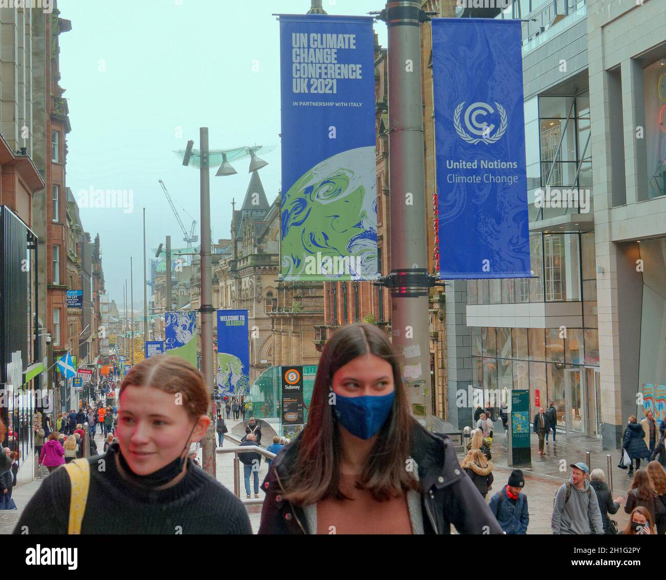 Glasgow, Scotland, UK, 18th October, 2021. UK  Weather:  Rain put a damper on the cop26 preparations amid calll offs from the stars as locals went shopping in the style mile od the city, buchanan street. Credit: Gerard Ferry/Alamy Live News Stock Photo