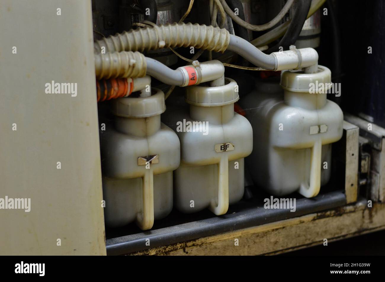 Kovrov, Russia. 31 October 2017. Containers with chemicals for processing photographic paper printer processor minilab Noritsu QSS 1501Z in the photo Stock Photo
