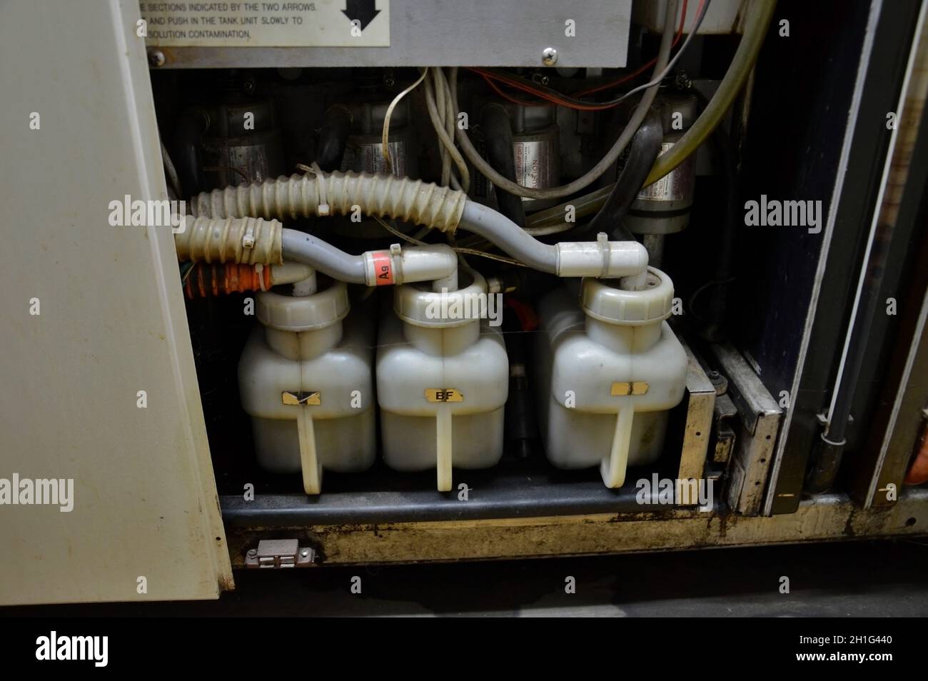 Kovrov, Russia. 31 October 2017. Containers with chemicals for processing photographic paper printer processor minilab Noritsu QSS 1501Z in the photo Stock Photo