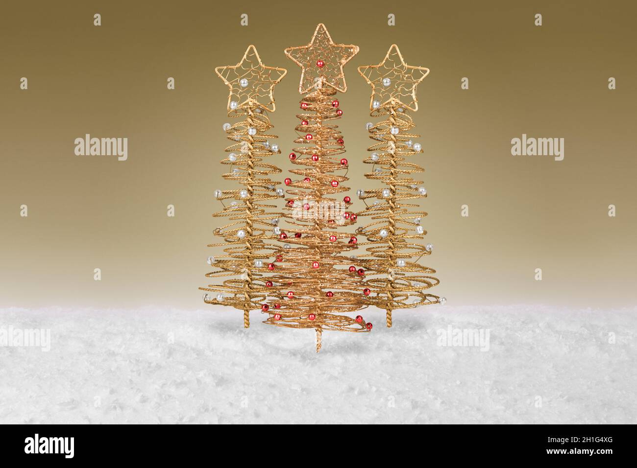 Gold wire tree Christmas Decoration on a fake snow background Stock ...