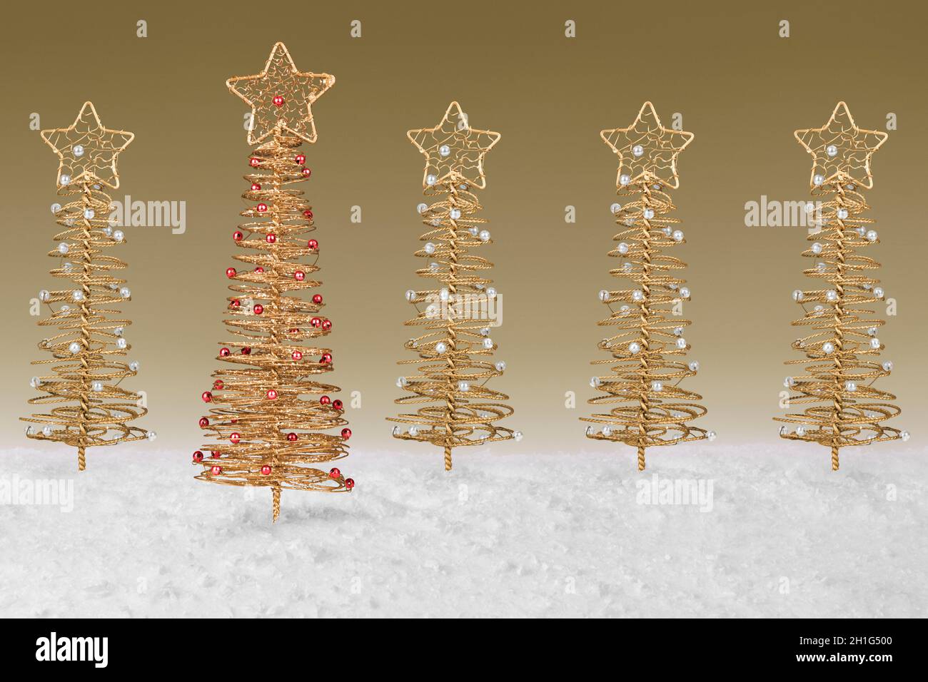 Gold wire tree Christmas Decoration on a fake snow background Stock ...