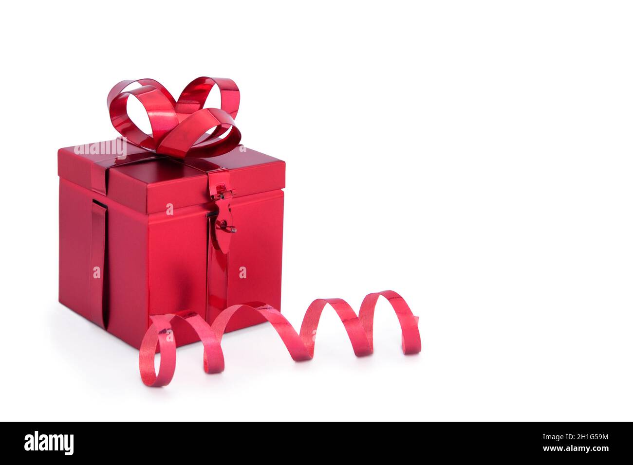 Red Metal Christmas Present Box with red ribbon isolated on a white ...