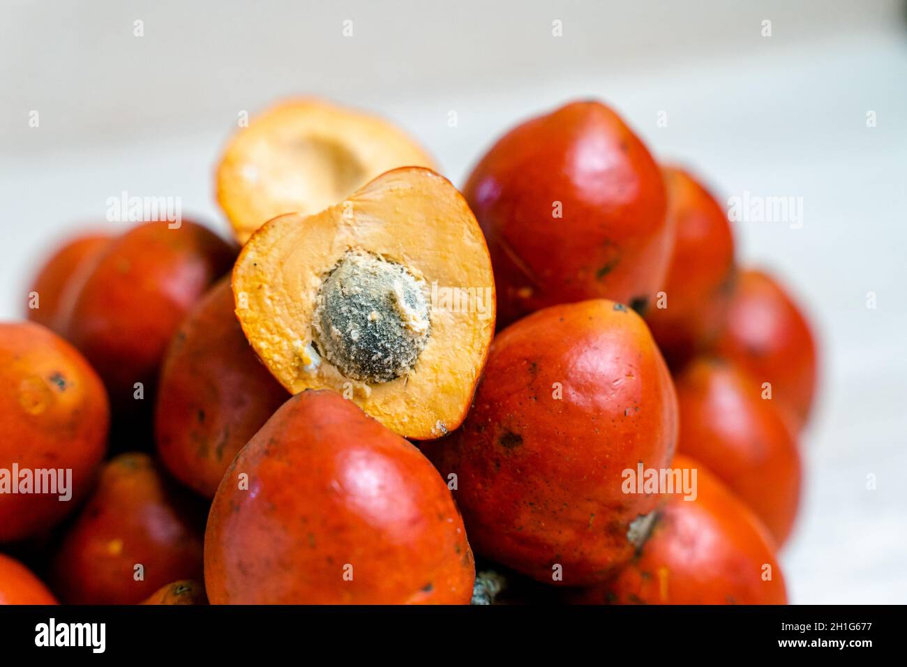 Halved chontaduro fruit with a core; popular plant in Ecuador Stock Photo