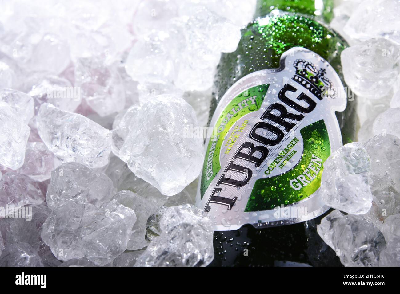 POZNAN, POL - JUN 10, 2020:  Bottle of Tuborg beer, produced by a Danish brewing company founded in 1873 near Copenhagen Stock Photo