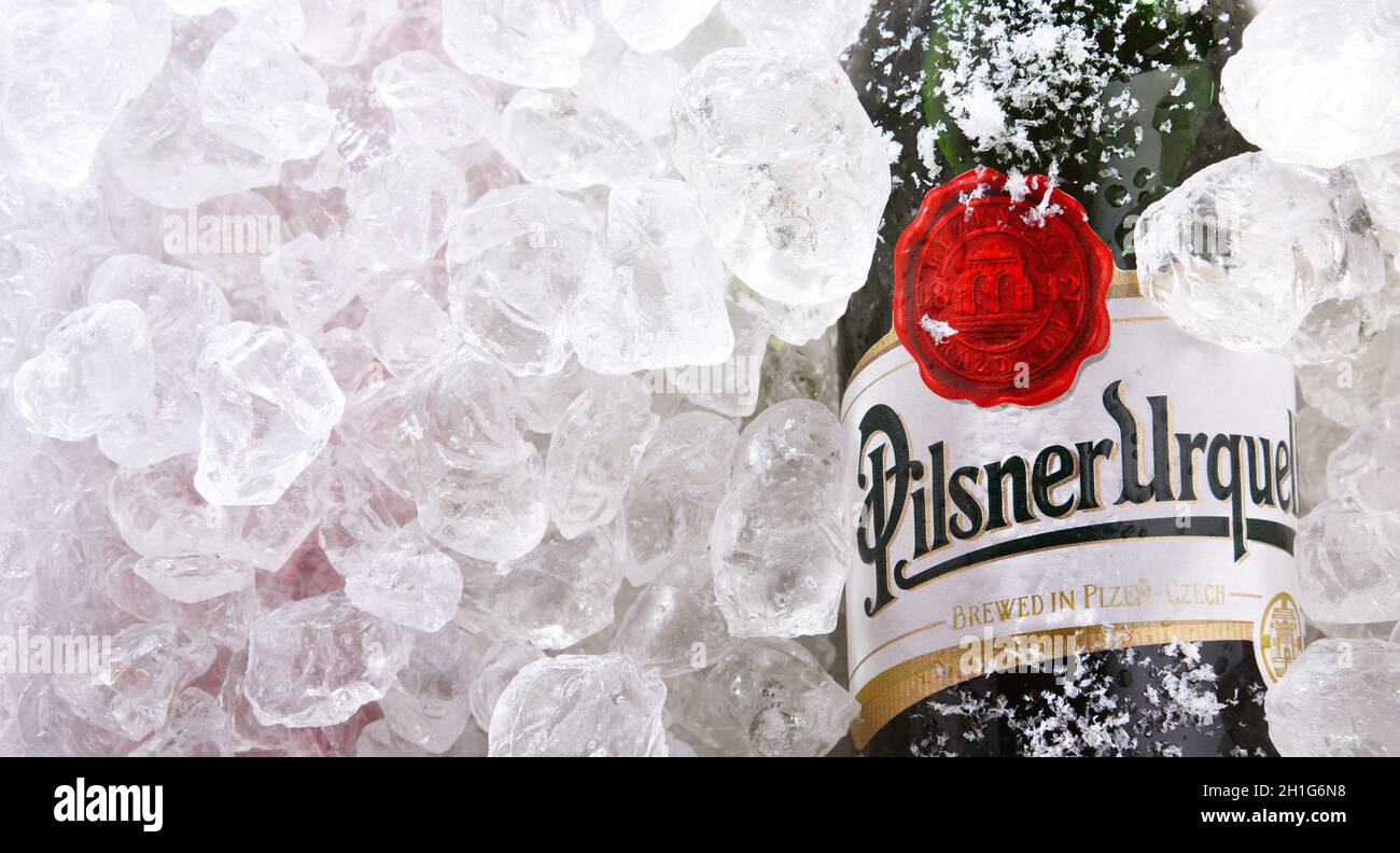 POZNAN, POL - MAY 28, 2020: Bottles of Plzensky Prazdroj, the first pilsner beer in the world, known better by its German name Pilsner Urquell Stock Photo