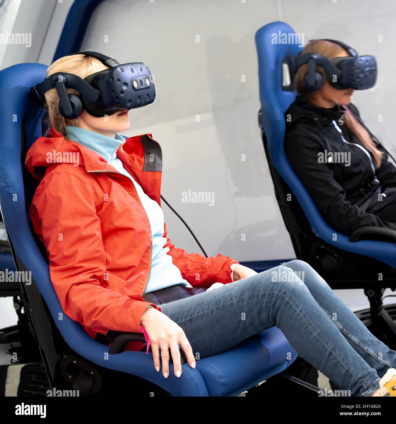Girl using vr headset sitting hires stock photography and images Alamy