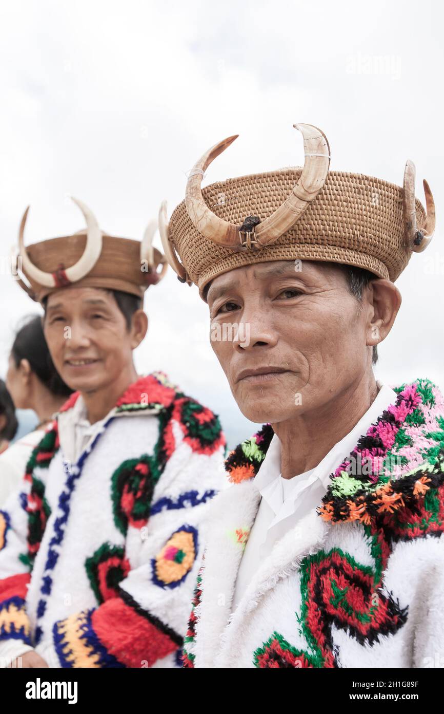 Chiang Mai, Thailand - JULY 30, 2010: Kachin or Jingpo ethnic senior men in traditional clothing wearing traditional rattan hats with tusks of boar. Stock Photo