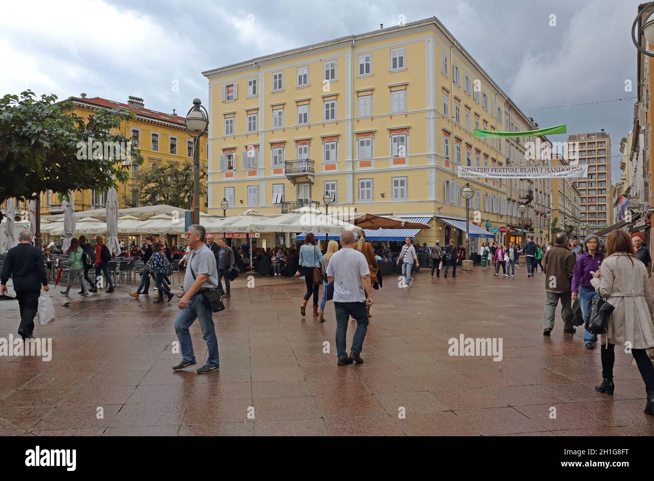 Rijeka, Croatia - October 17, 2014: People Walking at Korzo Street at Rainy Autumn Day in Rijeka, Croatia. Stock Photo