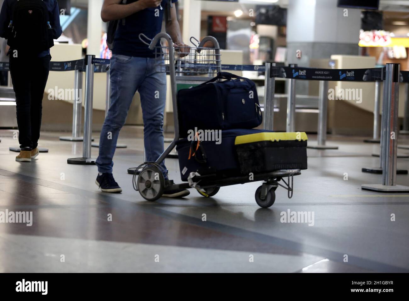 salvador, bahia / brazil - september 22, 2017: passengers are seen poking cart with suitcase in the lobby of the airport of the city of Salvador. *** Stock Photo