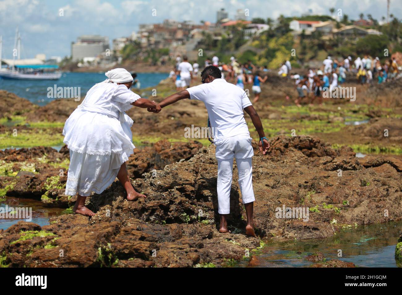 salvador, bahia / brazil - february 2, 2015: supporters of candomble are seen on the Rio Vermelho beach in the city of Salvador during a party in hono Stock Photo