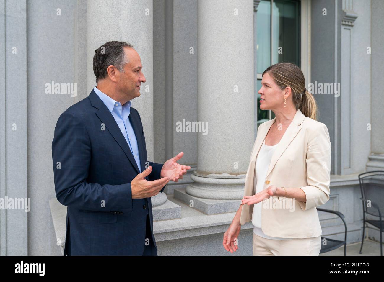 Washington, United States of America. 03 August, 2021. U.S Second Gentleman Douglas Emhoff, left, and his Chief of Staff Julie Mason meet outside on the balcony in the Eisenhower Executive Office Building at the White House August 3, 2021in Washington, D.C. Credit: Cameron Smith/White House Photo/Alamy Live News Stock Photo