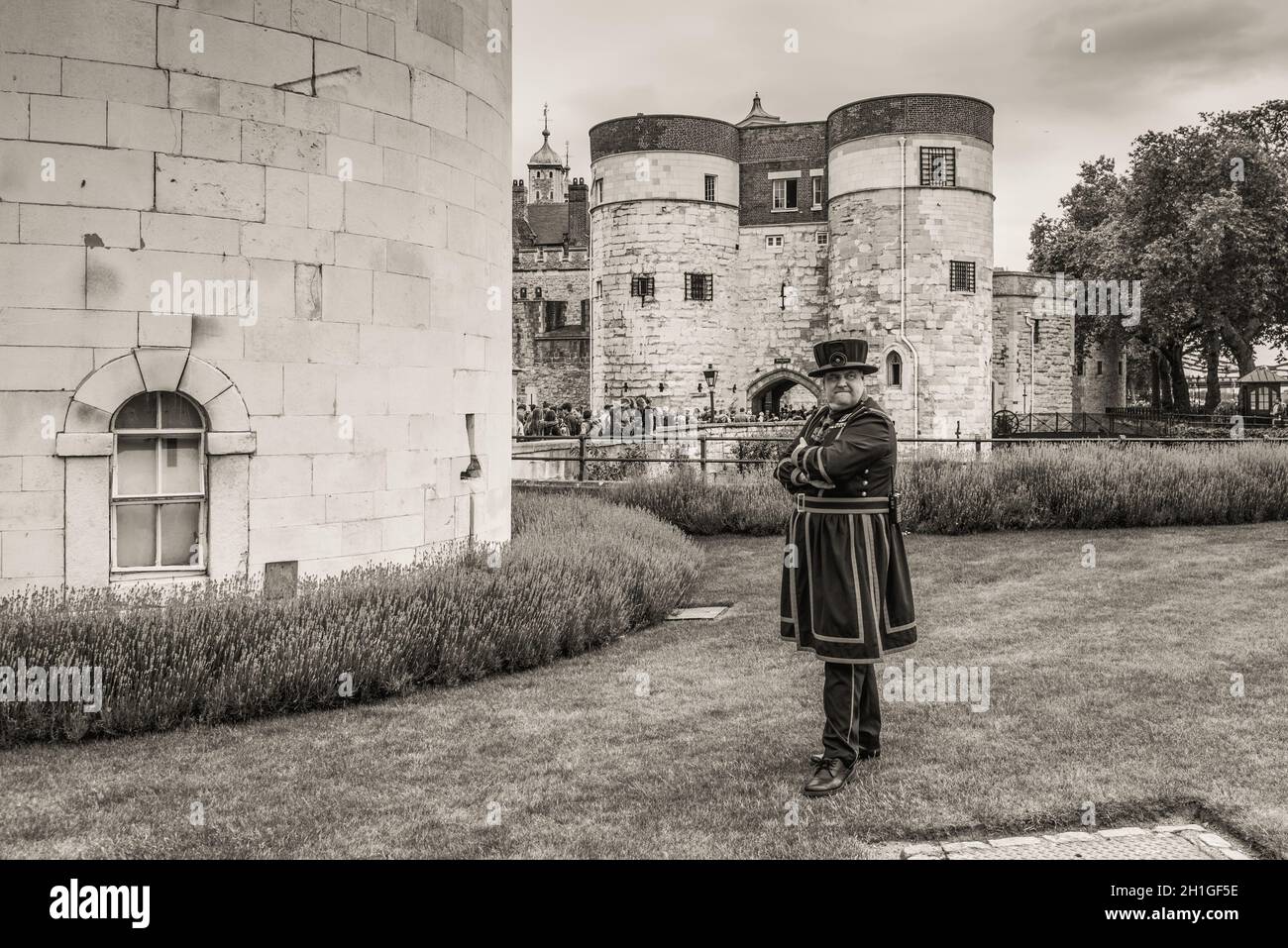 London, UK - May 23, 2017: Yeomen Warders of Tower of London (Beefeaters). Beefeaters are ceremonial guardians of the Tower of London. Monochrome sepi Stock Photo