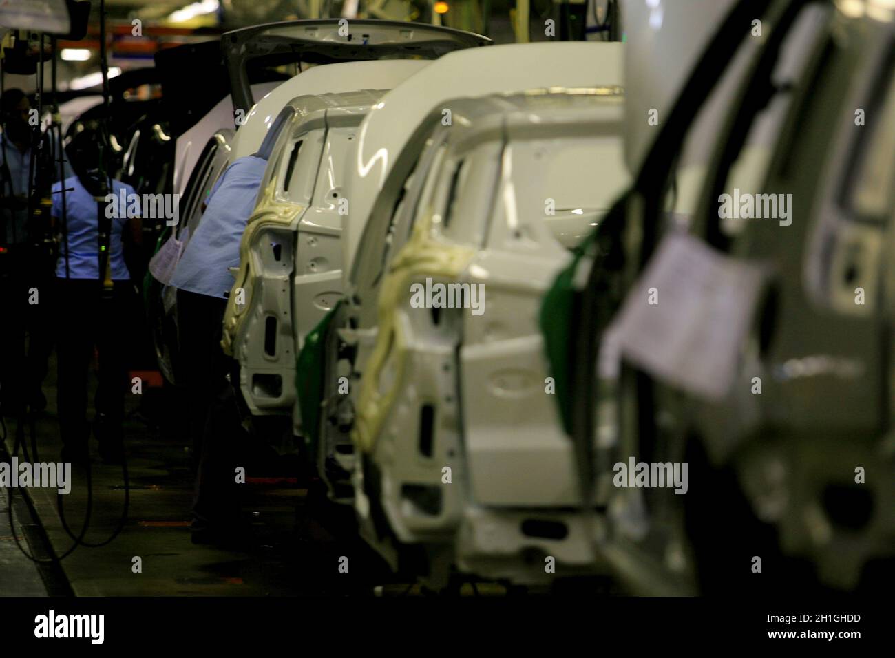 camacari, bahia / brazil - december 12, 2013: workers are seen on the assembly line at the Ford factory in the Industrial Pole of the city of Camacari Stock Photo