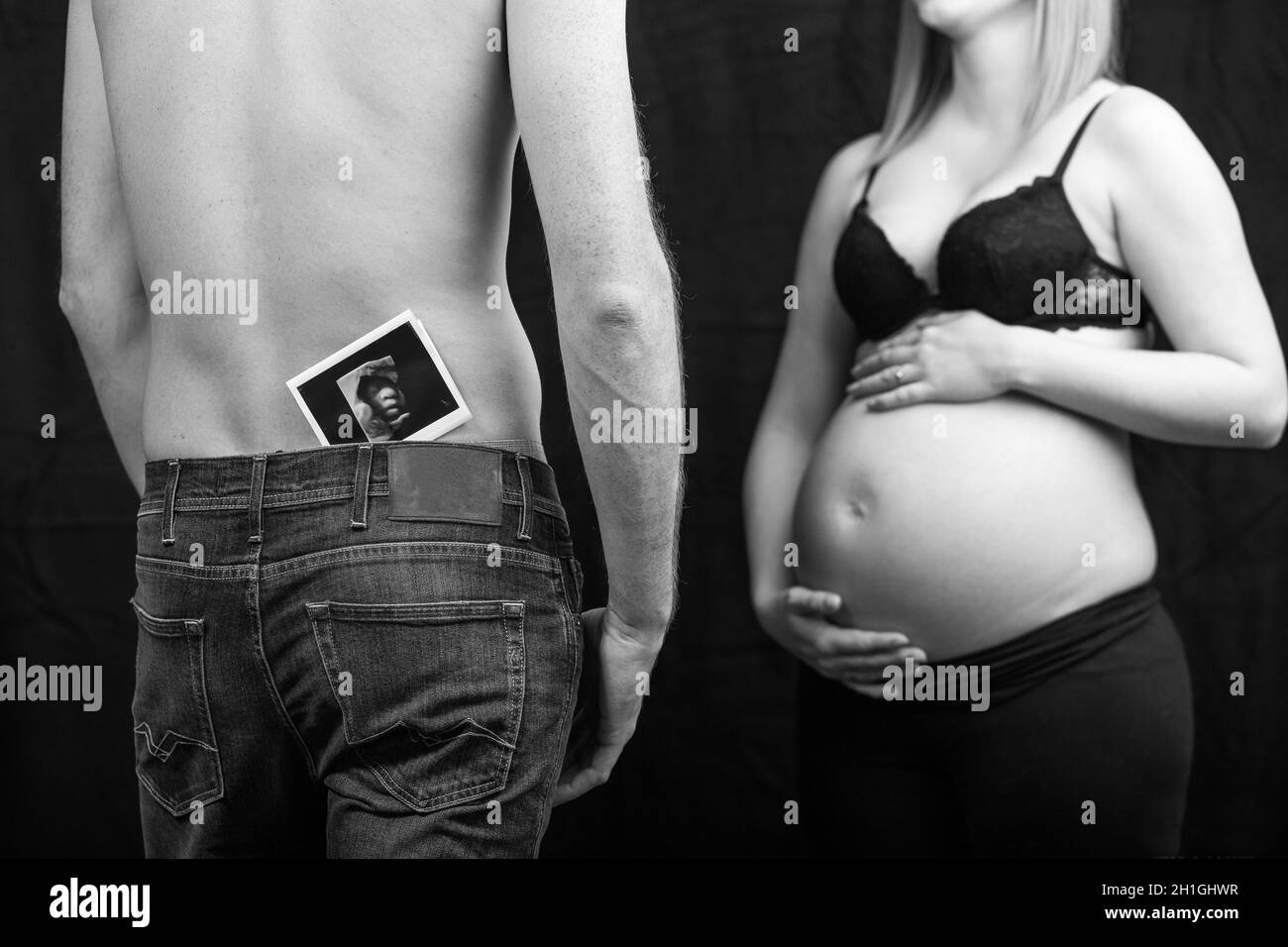 pregnant couple in love with baby belly. Hands on stomach baby bump. husband hand pregnant belly Stock Photo