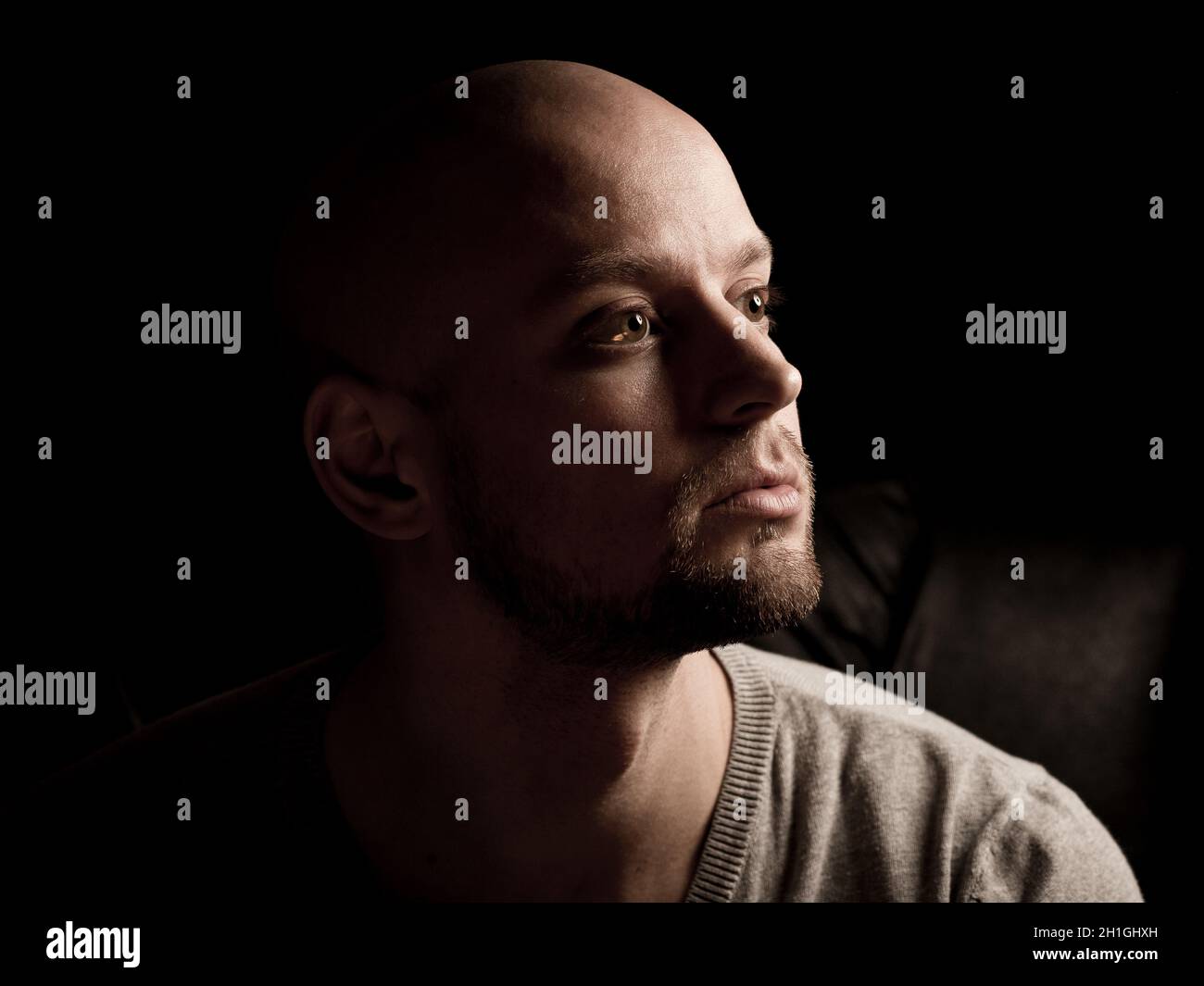 skinhead baldness shaved head man angry racist anger Stock Photo