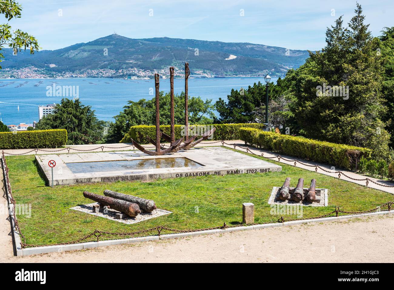 Vigo, Spain - May 20, 2017: Scenic view of five cannons and three anchors in front of bay in ancient historic spanish town Vigo in Galicia, Spain. Stock Photo