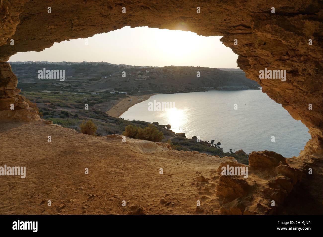 scenic view from Talmixta cave overlooking the Ramla Bay, on Gozo Island, Malta. Photo by Willy Matheisl Stock Photo