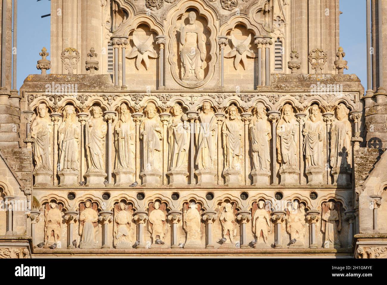 WELLS, UK - October 07, 2011. Christ the Judge with the twelve apostles. Statues on the West Front gable of Wells Cathedral. Wells, Somerset, UK Stock Photo
