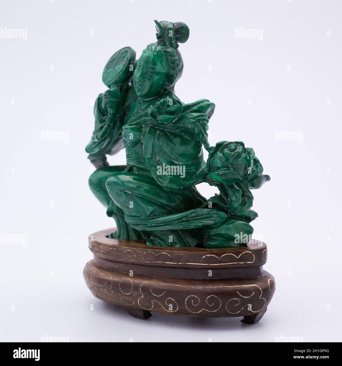 Chinese Malachite carving of a Female Figure on a Silver Wire Inlaid Wooden Stand Stock Photo