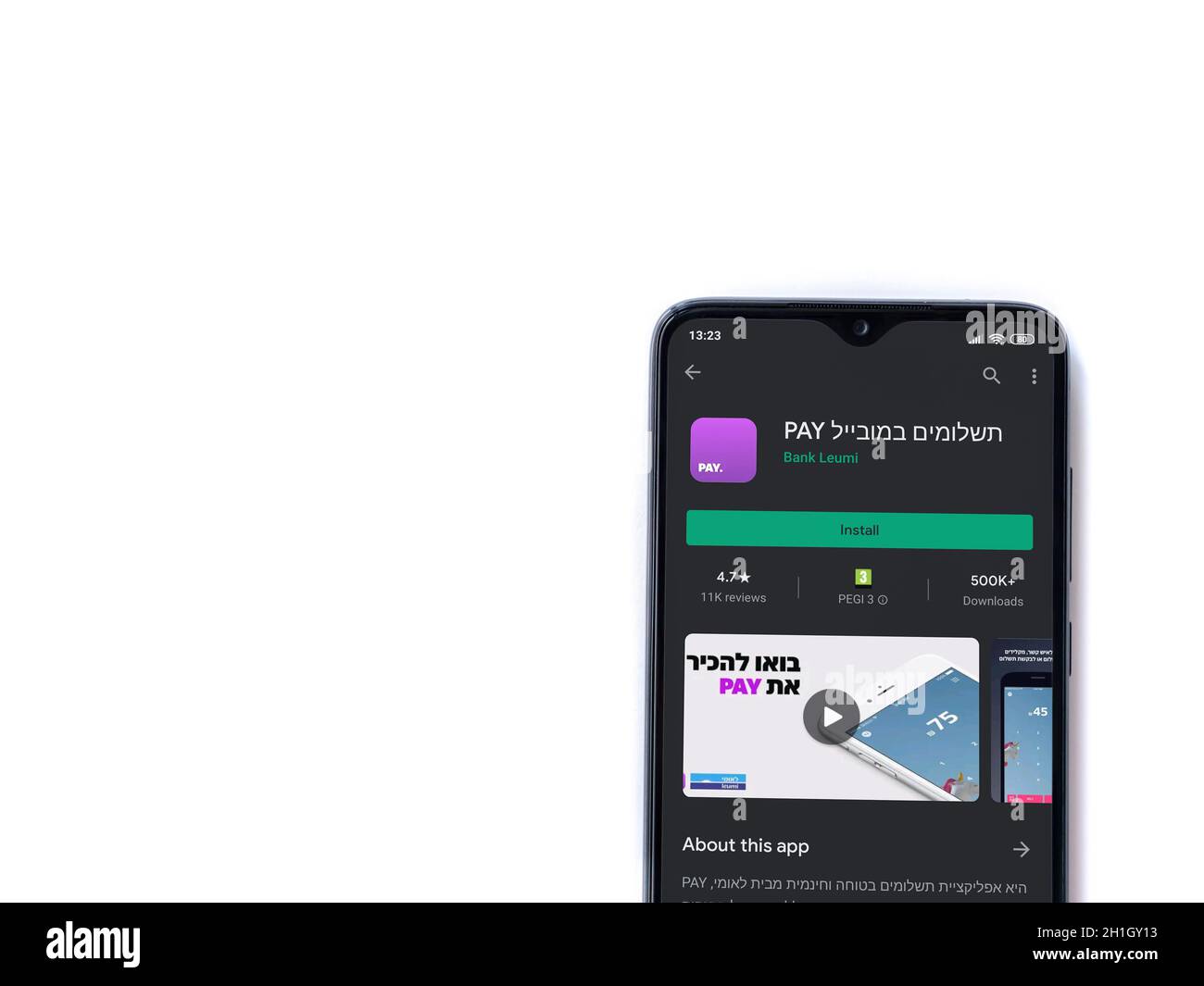 Lod, Israel - July 8, 2020: PAY app play store page on the display of a black mobile smartphone isolated on white background. Top view flat lay with c Stock Photo