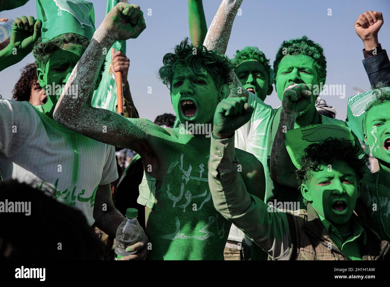 Sanaa, Yemen. 18th Oct, 2021. Houthi rebel supporters with their faces and bodies painted take part in a celebration marking the anniversary of the birth of Islam's Prophet Muhammad (Mawlid al-Nabi) in Sanaa. Credit: Hani Al-Ansi/dpa/Alamy Live News Stock Photo
