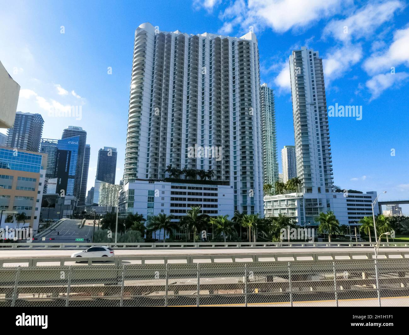 Miami, USA - November 30, 2019: Downtown Miami cityscape view with condos and office buildings against blue sky. Stock Photo