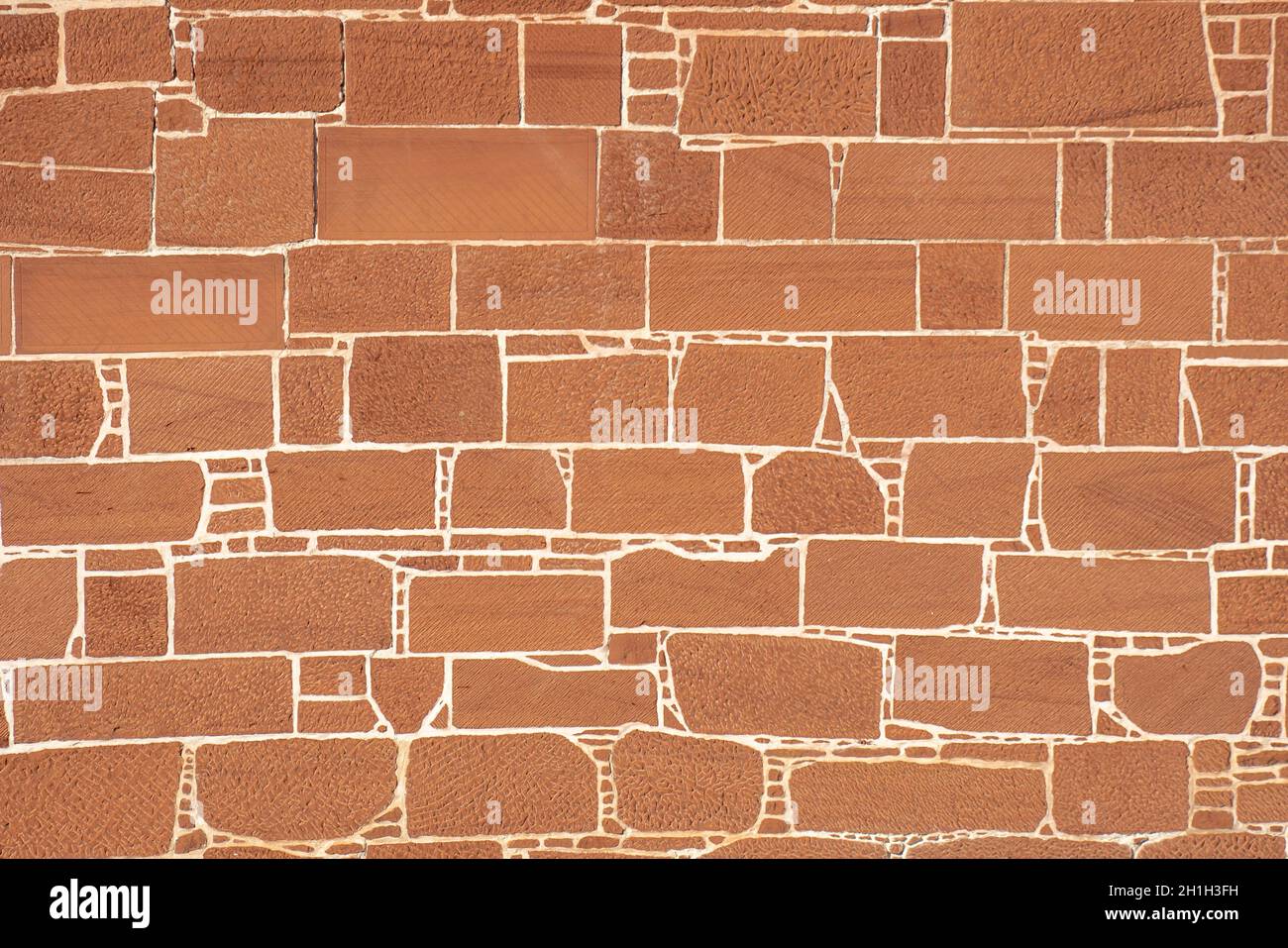 Red stone wall, walls, constructed, farmers, primitive people, dry stone wall, mortar, plaster, city walls, castles, fortifications, patterns, unique. Stock Photo