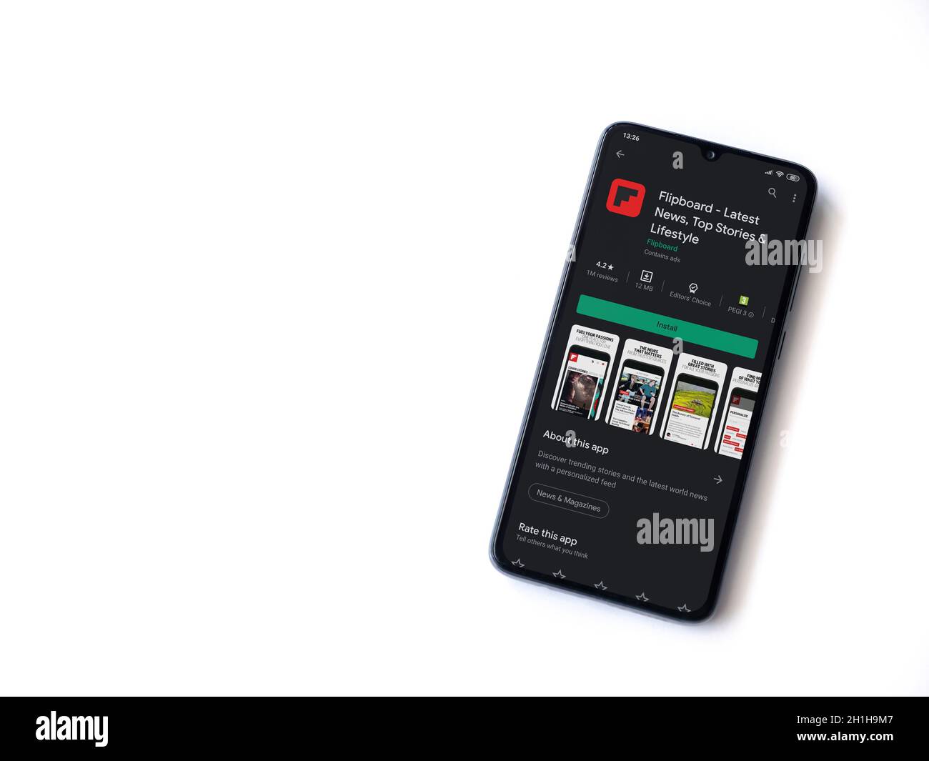 Lod, Israel - July 8, 2020: Flipboard app play store page on the display of a black mobile smartphone isolated on white background. Top view flat lay Stock Photo