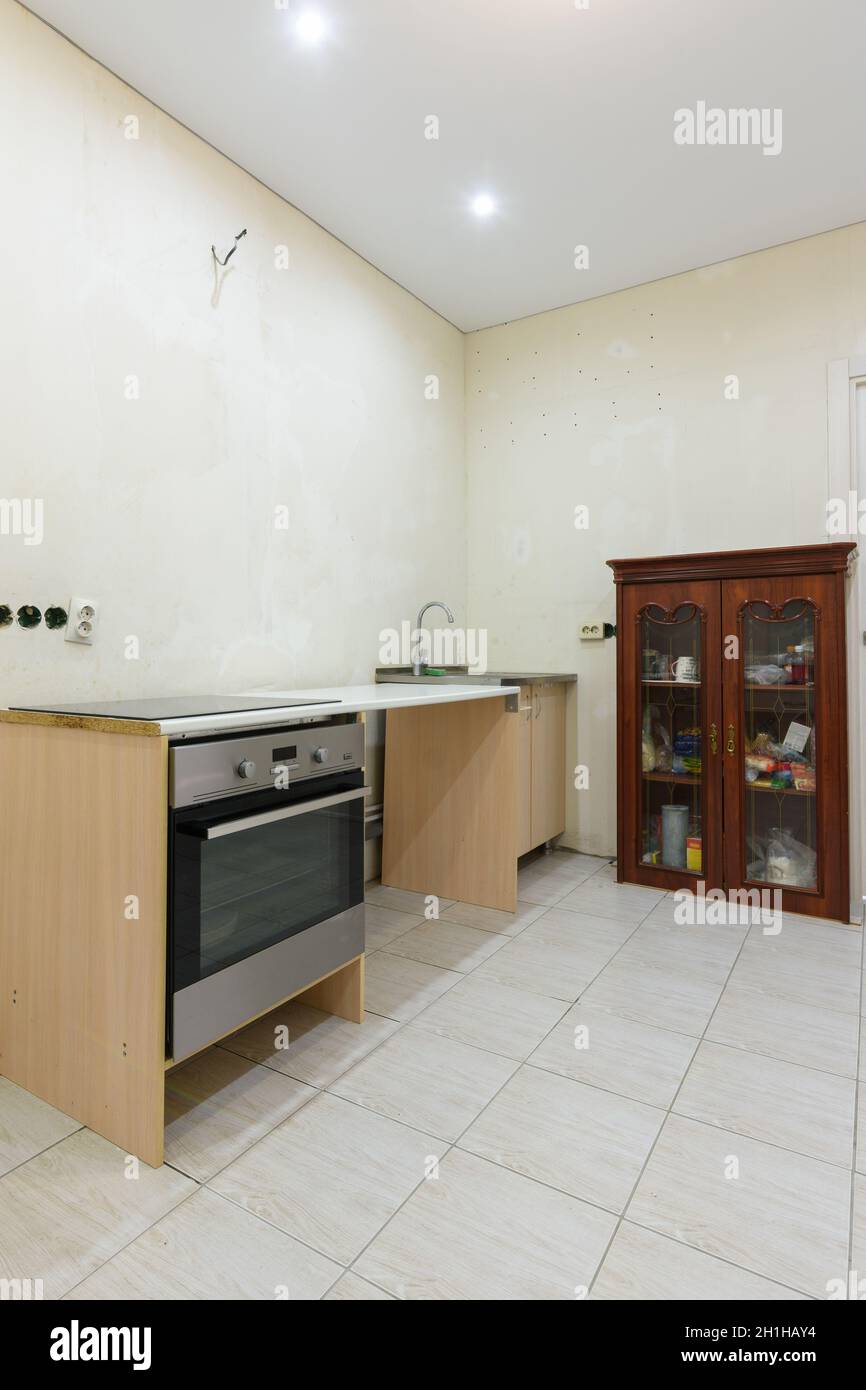 View of The interior of a budget kitchen, assembled for the period of apartment ...