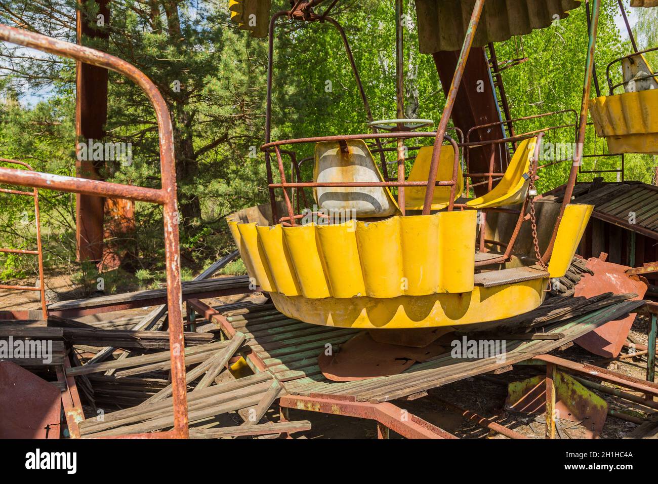 Old broken rusty metal radioactive electric wheel abandoned, the park of culture and recreation in the city of Pripyat, the Chernobyl disaster, Ukrain Stock Photo