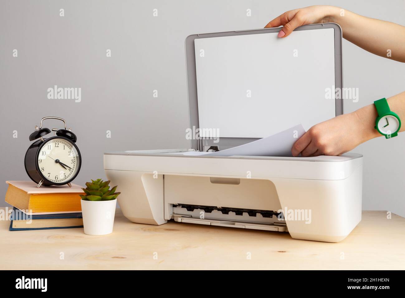 Close up of woman using a printer machine Stock Photo - Alamy