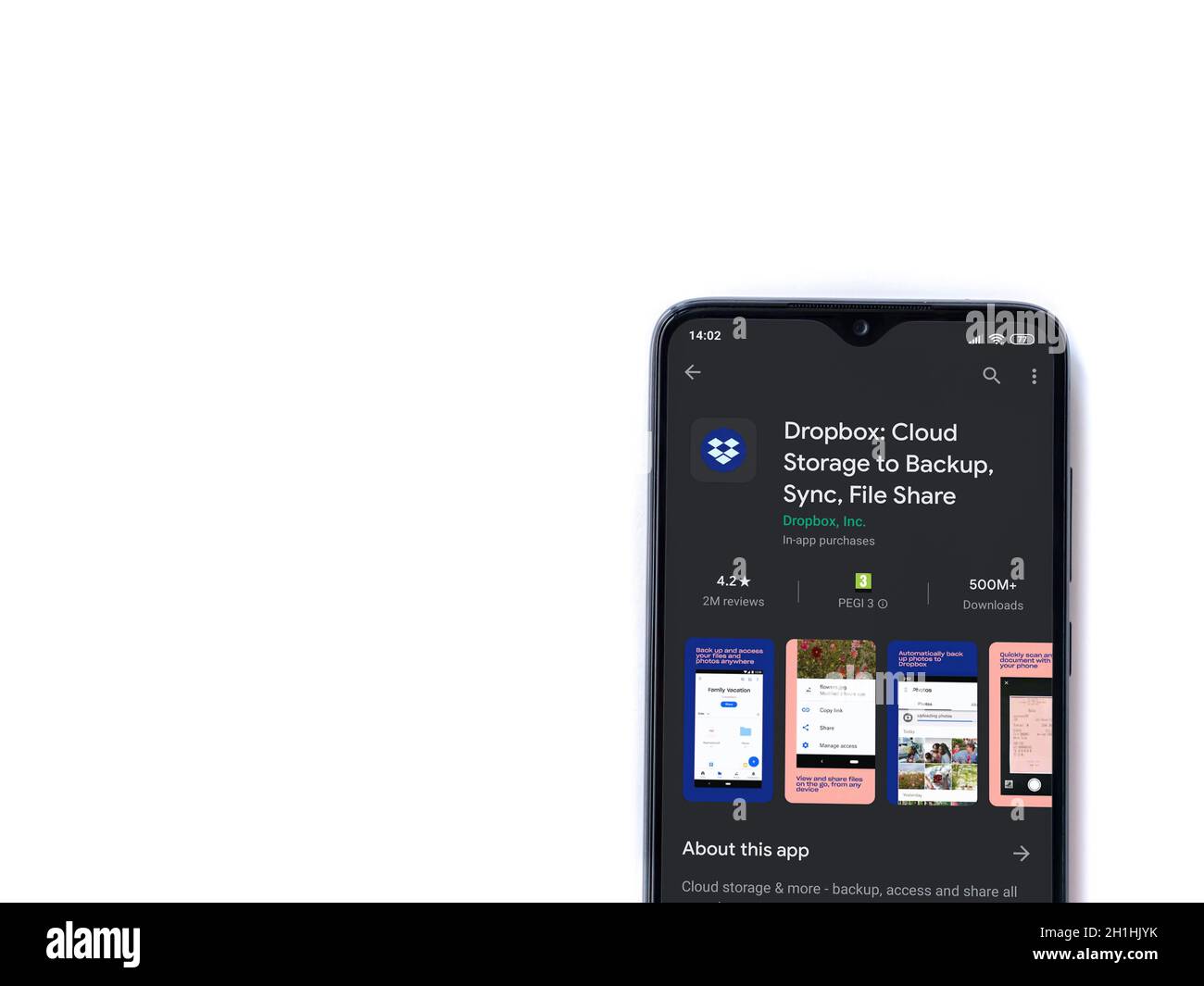 Lod, Israel - July 8, 2020: Dropbox app play store page on the display of a black mobile smartphone isolated on white background. Top view flat lay wi Stock Photo