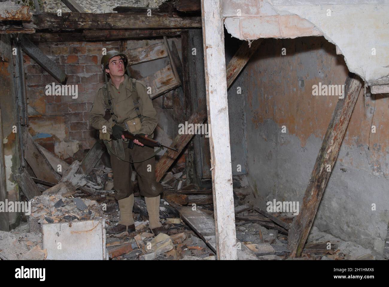 a young American soldier ww2 in the ruins Stock Photo