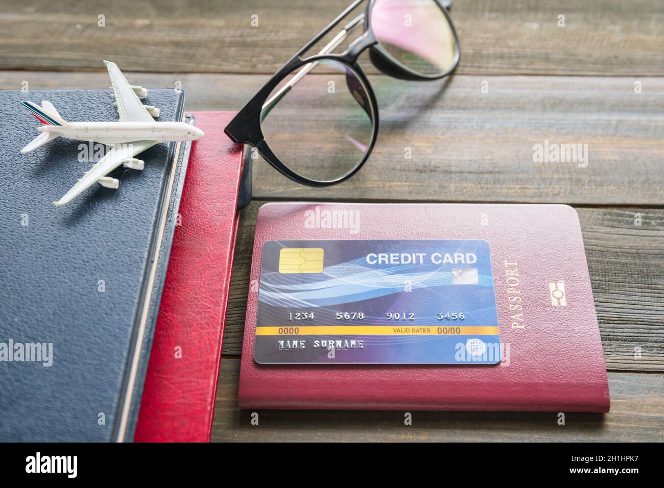 Credit card put on passport on wooden desk , Preparation for Traveling
