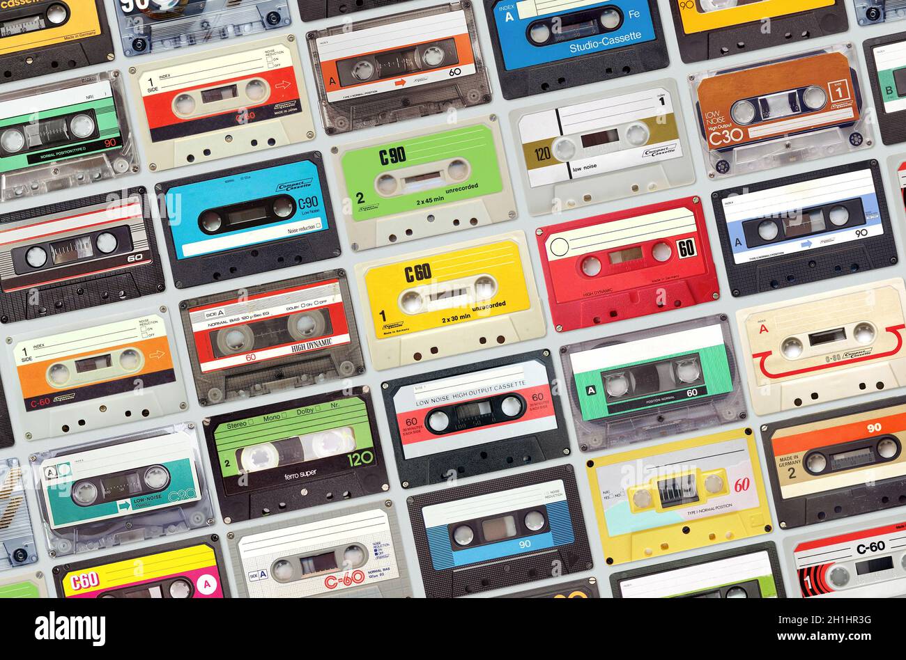 Large set of old vintage audio tape cassettes on gray background ...