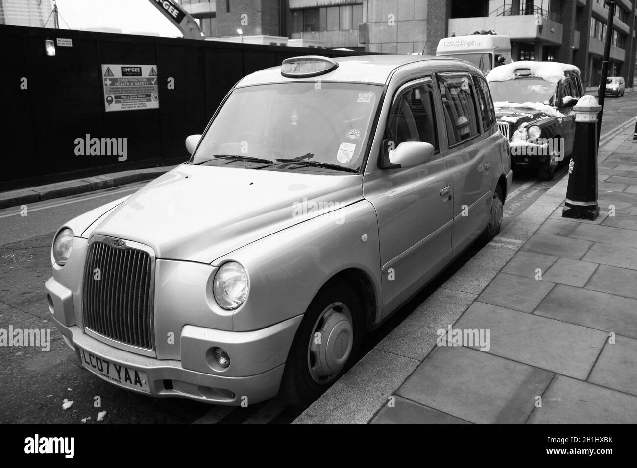 Lonodn, UK - December 1, 2010 : Taxi in the street of London on May 8, 2010 in London, UK. Cabs, Taxis, are the most iconic symbol of London as well a Stock Photo