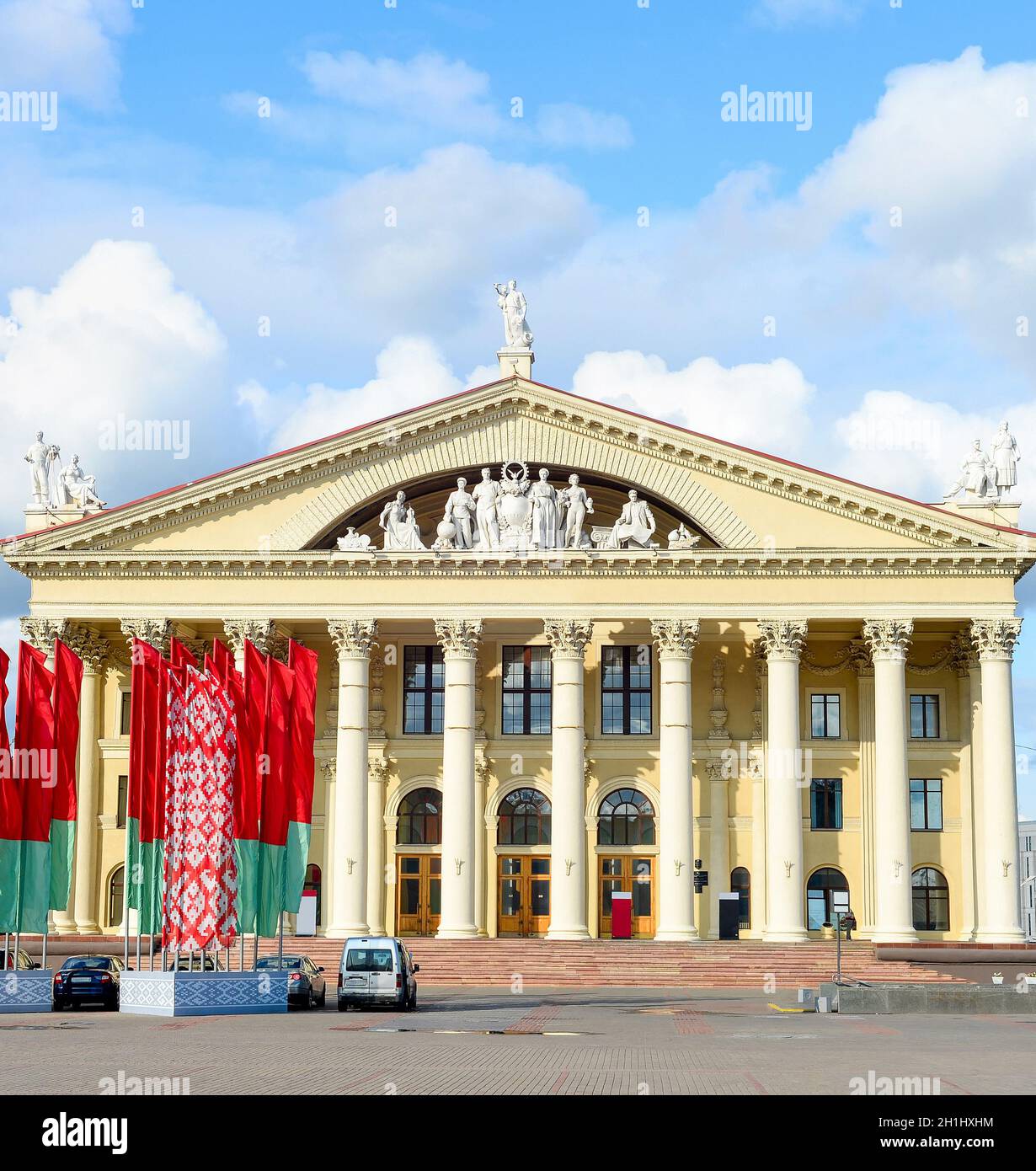 Labour Union Palace of Culture, waving national flags at central October Square, Minsk, Belarus Stock Photo