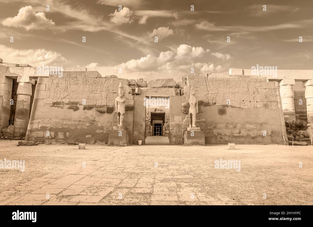 Statues and columns in Karnak temple, Luxor. Sepia colors Stock Photo