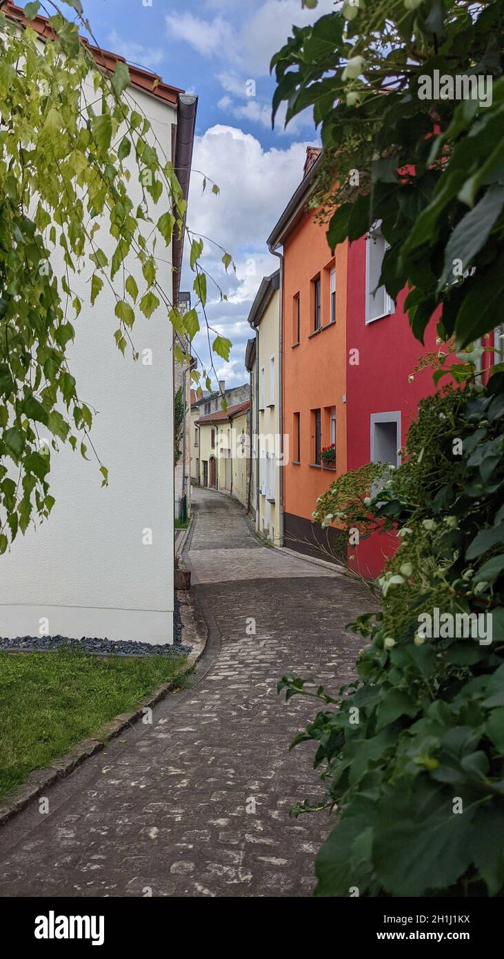 Beautiful view of the narrow street under the blue sky Stock Photo - Alamy