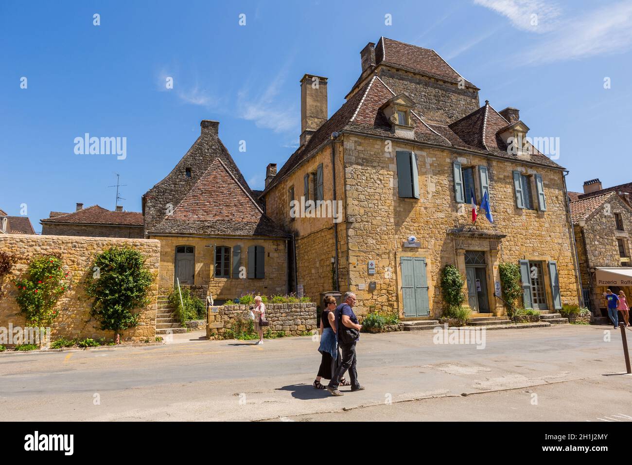 Domme, France - August 14, 2019:Tourists visiting the medieval town of Domme in the Dordogne France Stock Photo