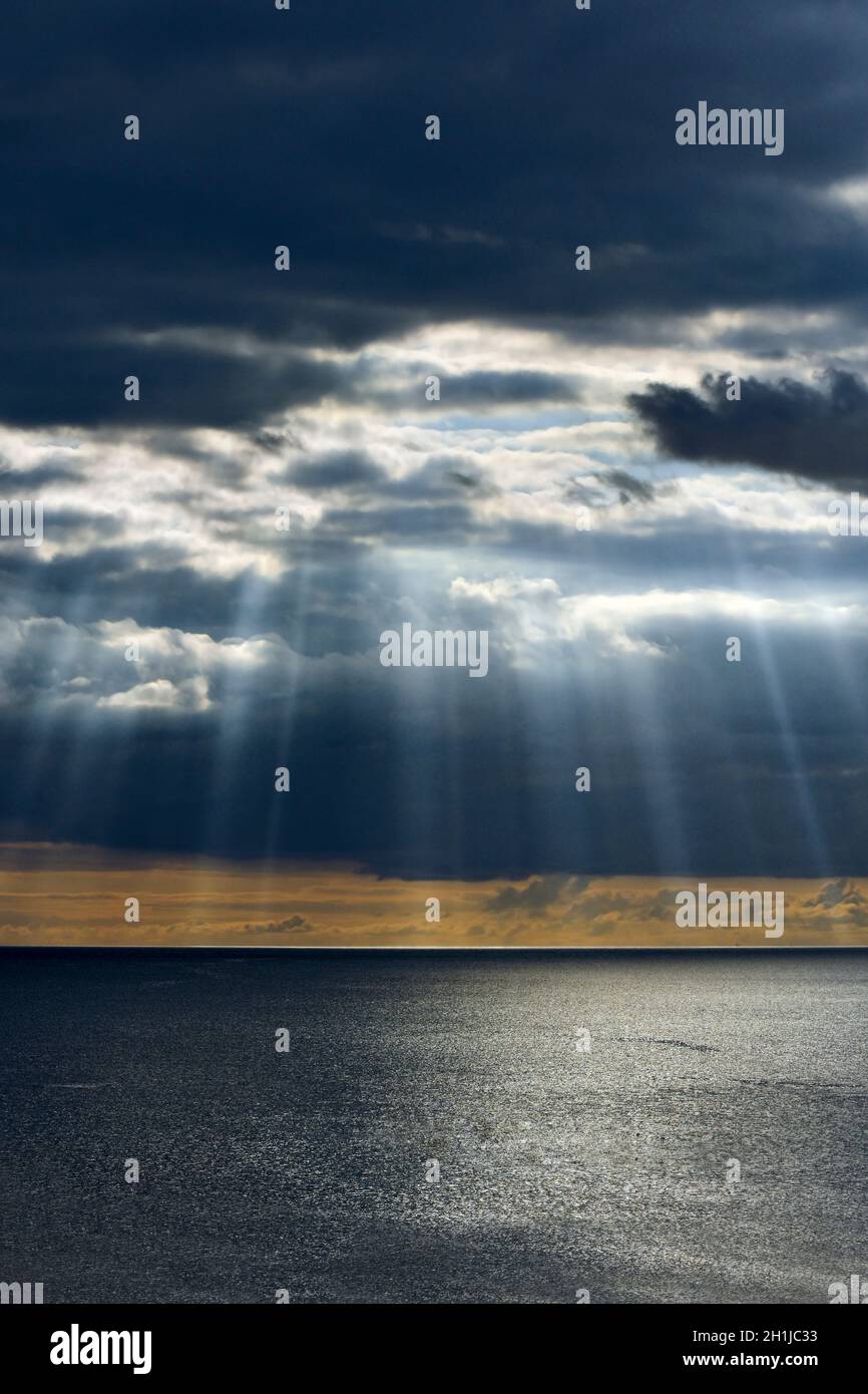 Stunning sunrays breaking through storm clouds in South Devon Stock Photo