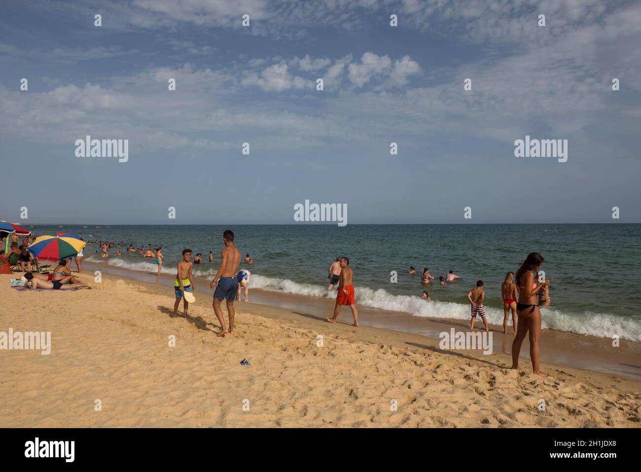 MANTA ROTA, PORTUGAL - AUGUST 25, 2017: People at the famous beach of ...
