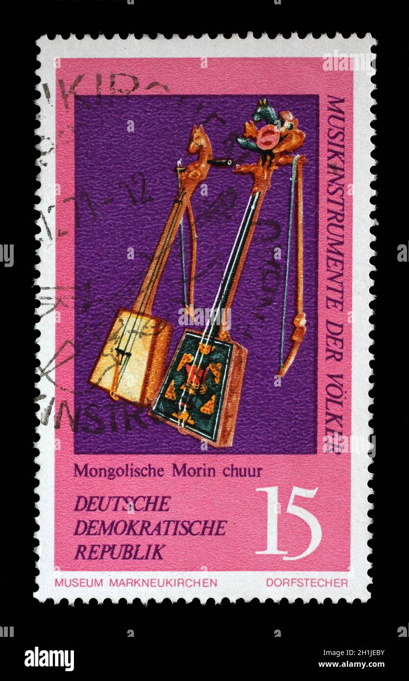 Stamp issued in Germany - Democratic Republic (DDR) shows Two Morin Khuur, Mongolia, Musical Instruments from the Music Museum in Markneukirchen, circ Stock Photo