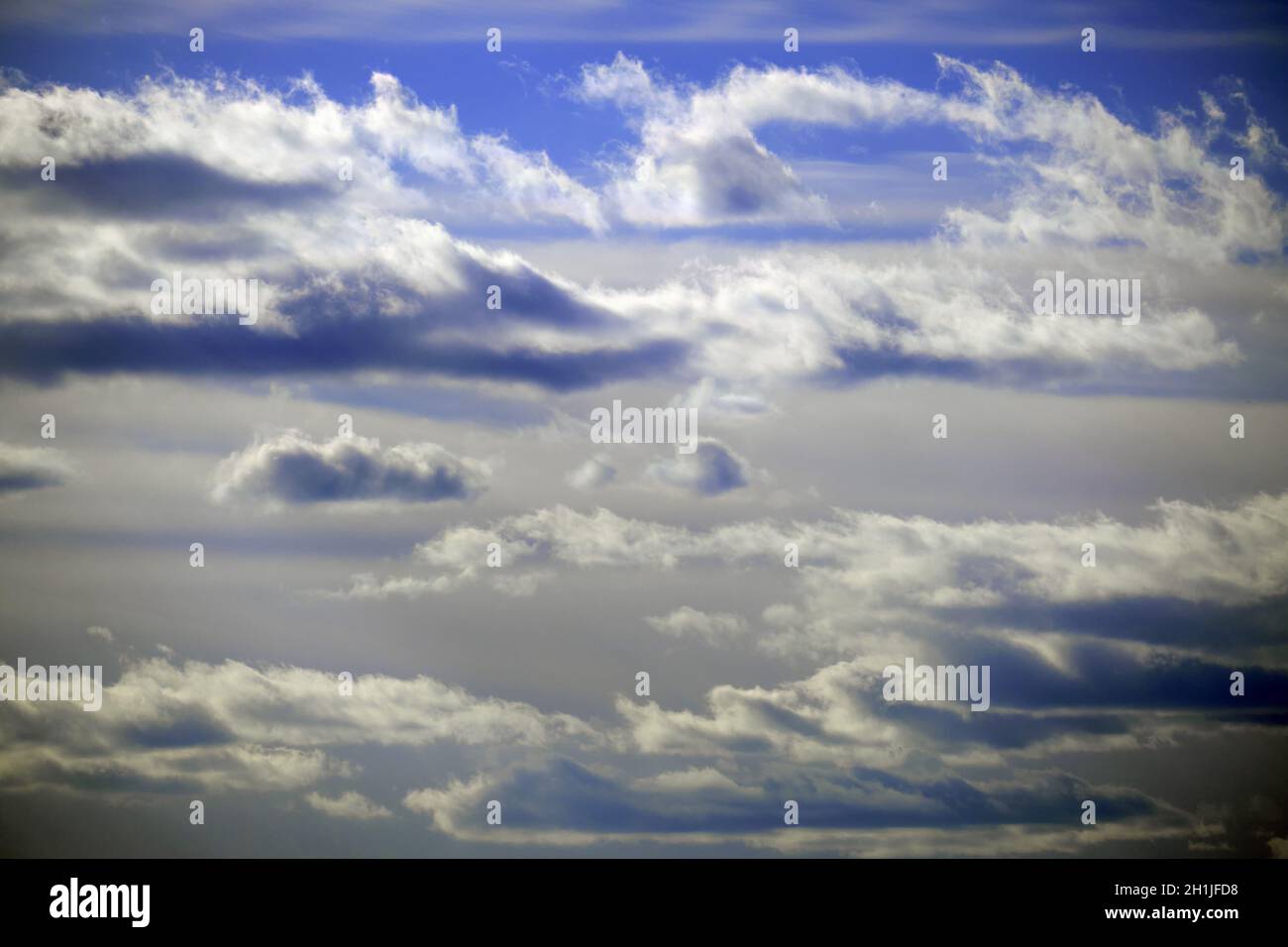 Dark clouds on a dramatic blue sky, background Stock Photo - Alamy