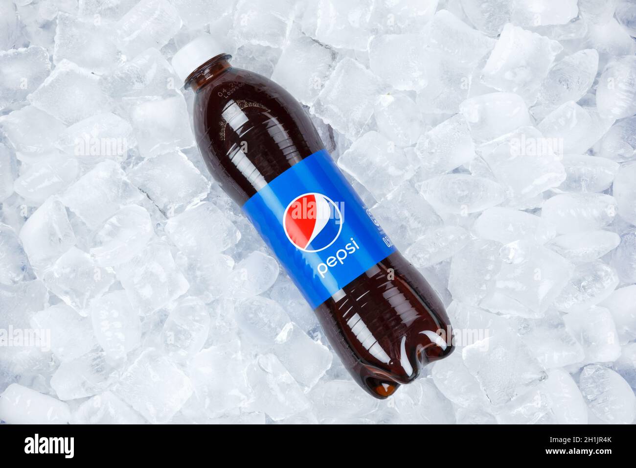 Stuttgart, Germany - August 31, 2021: Pepsi Cola in plastic bottle lemonade soft drink on ice cubes in Stuttgart, Germany. Stock Photo