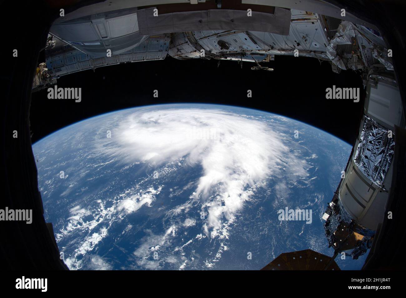 Wide angle view from the International Space Station of earth and a tropical storm (Tropical Storm Victor)  N Atlantic Ocean Stock Photo