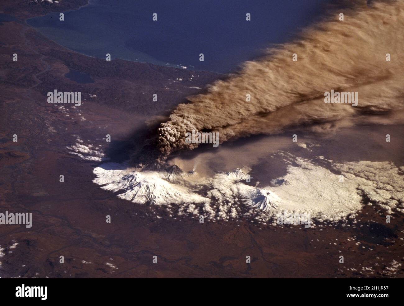 On October 1, 1994, Space Shuttle astronauts successfully took a series of photographs of Klyuchevskaya Volcano erupting near the east-central coast of Kamchatka Peninsula in Russia   A unique optimised and enhanced version of a NASA image / credit NASA. Stock Photo