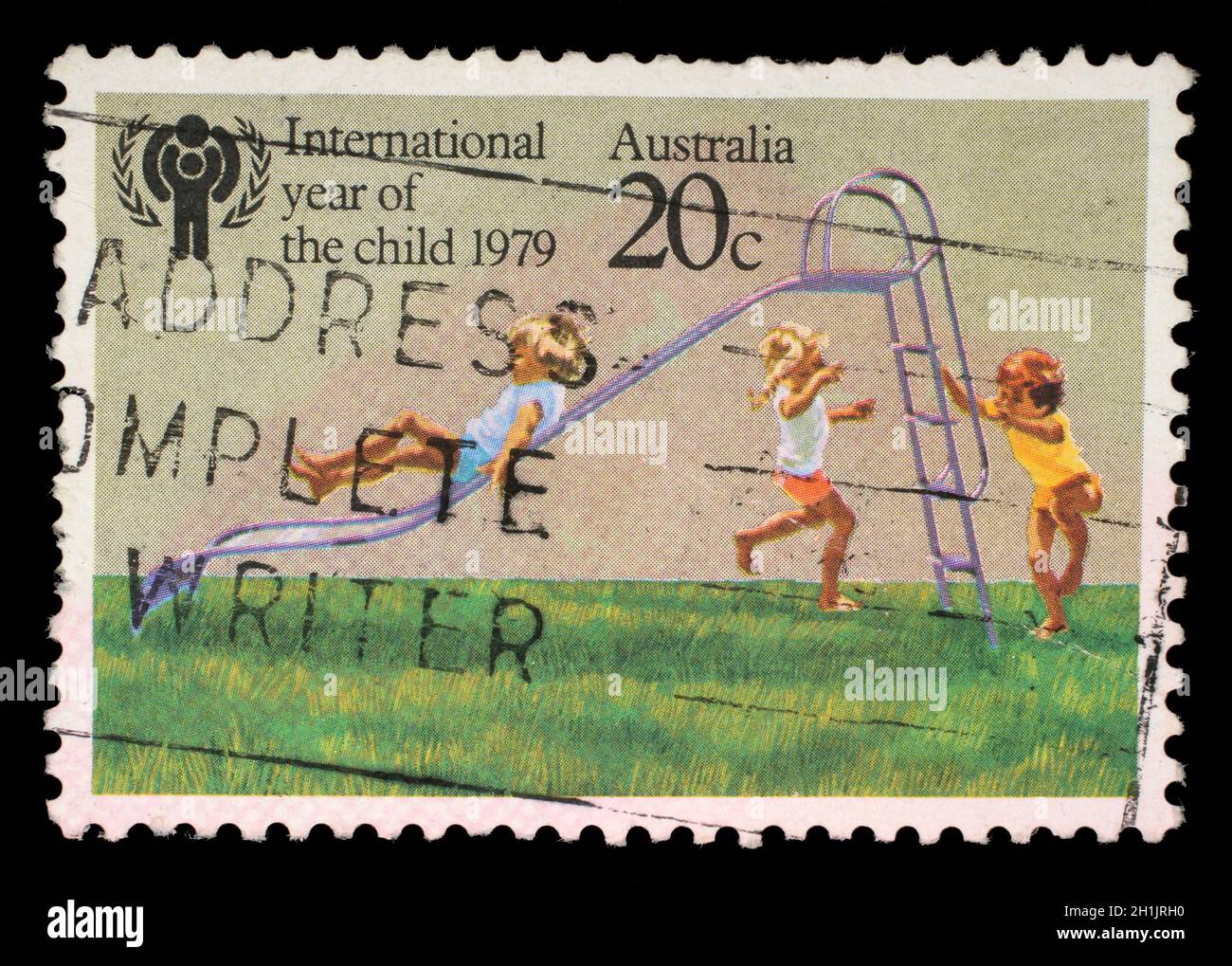 AUSTRALIA - CIRCA 1979: A stamp printed in Australia from the 'International Year of the Child' issue shows Children playing on Slide, circa 1979. Stock Photo